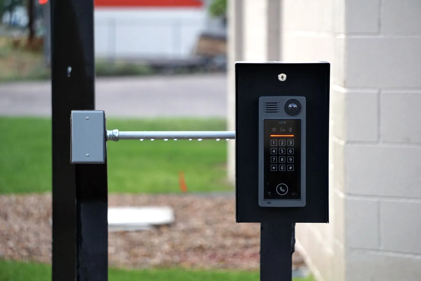 Contact Kincaid Alarm for a free security assessment Access control keypad and intercom mounted on a post beside a driveway gate